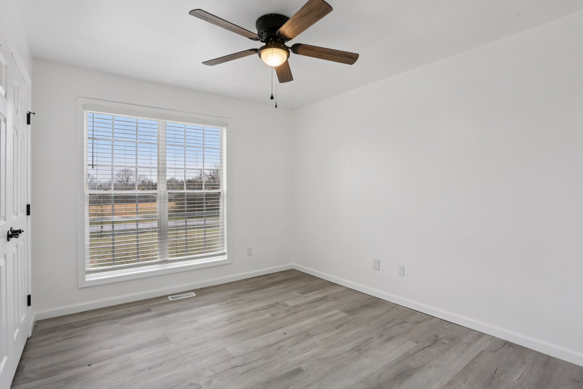 1101 Bugscuffle Road Wartrace, TN 37183 - Photo 21 of 42 wooden floor in an empty room with a window