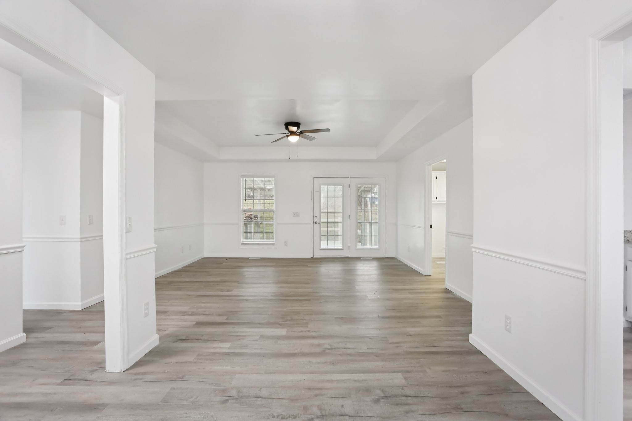 1101 Bugscuffle Road Wartrace, TN 37183 - Photo 9 of 42 a view of an empty room with wooden floor and a window