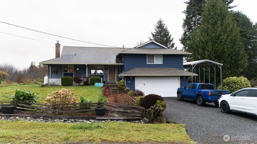 194 Sekiu Airport Road Sekiu, WA 98381 - Photo 1 of 40 a front view of a house with garden