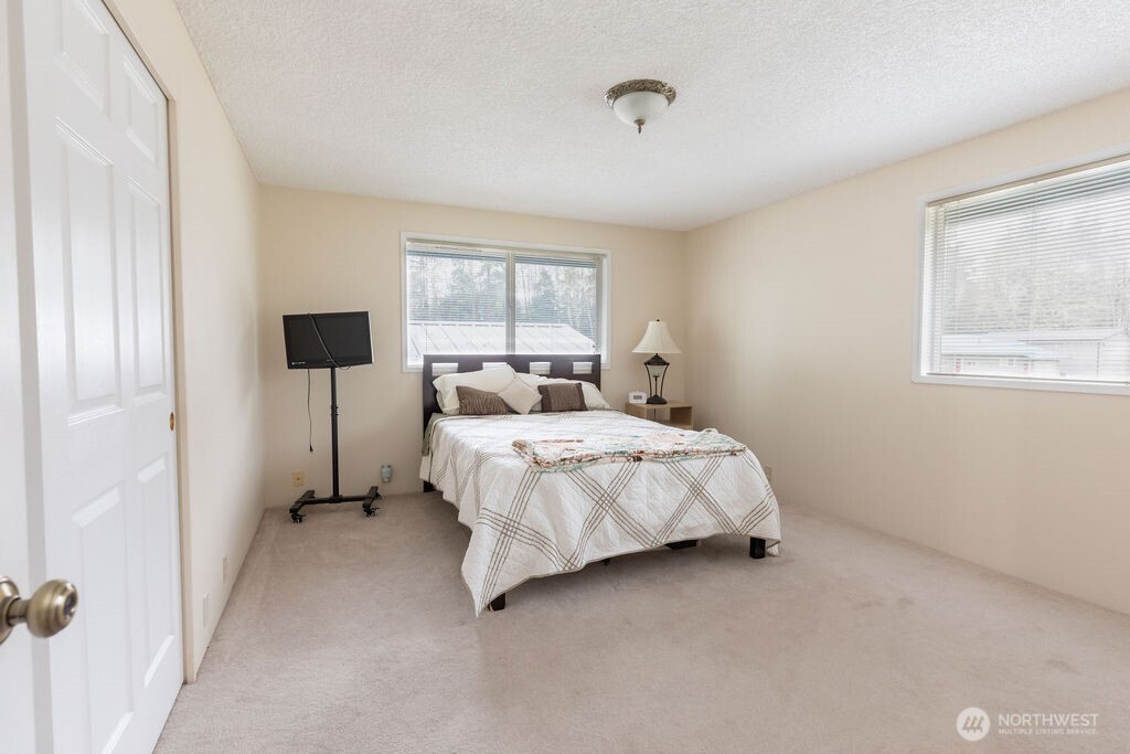 194 Sekiu Airport Road Sekiu, WA 98381 - Photo 14 of 40 a bedroom with a bed and a window