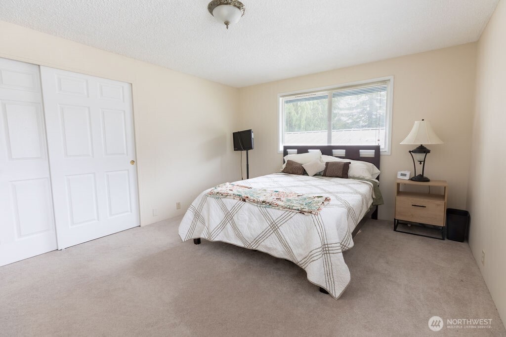 194 Sekiu Airport Road Sekiu, WA 98381 - Photo 15 of 40 a spacious bedroom with a bed and a window