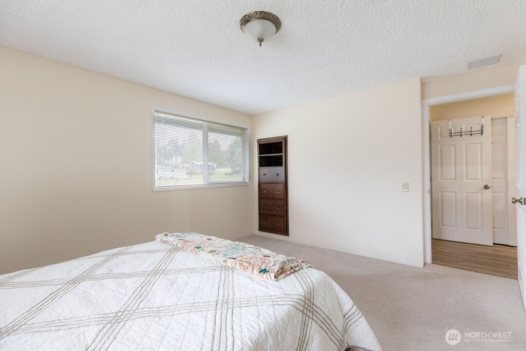 194 Sekiu Airport Road Sekiu, WA 98381 - Photo 16 of 40 a bedroom with a bed and a window