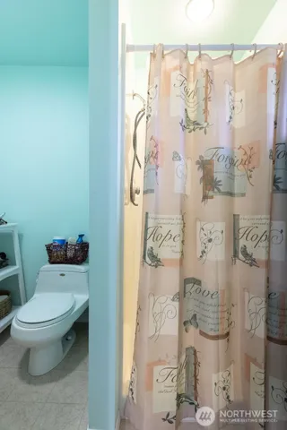 a white toilet sitting next to a bathroom sink