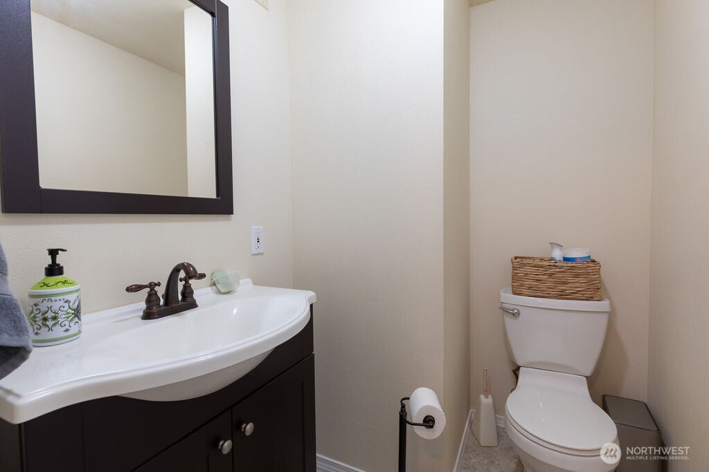 194 Sekiu Airport Road Sekiu, WA 98381 - Photo 27 of 40 a bathroom with a sink a toilet and mirror