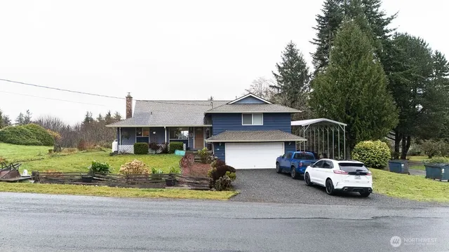 a view of a car parked in front of a house