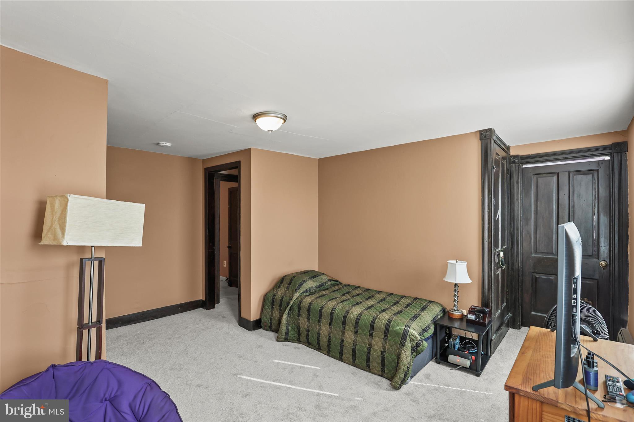 3220 Mt Carmel Road Upperco, MD 21155 - Photo 15 of 44 a bedroom with a bed and a flat screen tv