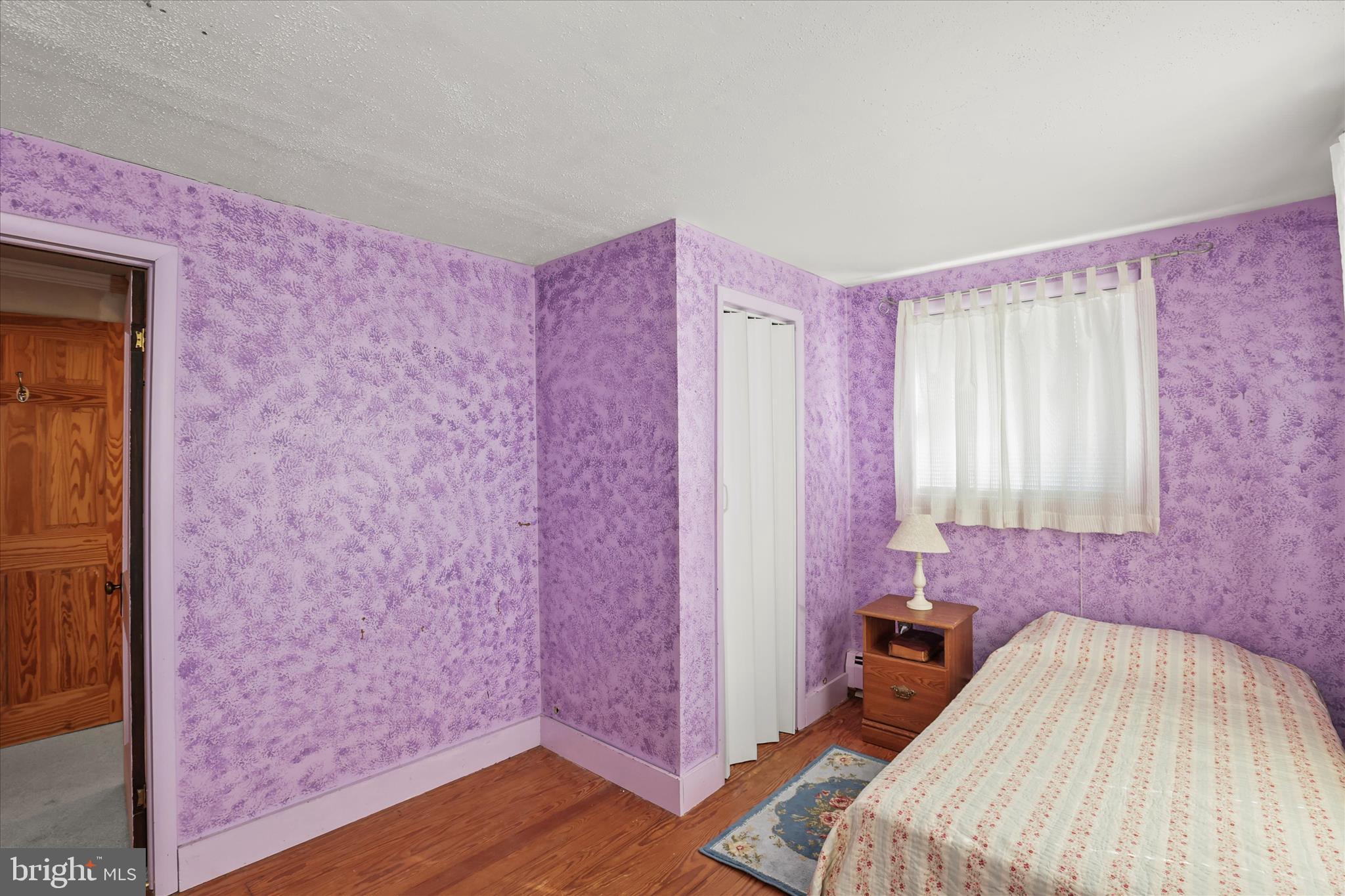 3220 Mt Carmel Road Upperco, MD 21155 - Photo 17 of 44 a bedroom with a bed and a dresser