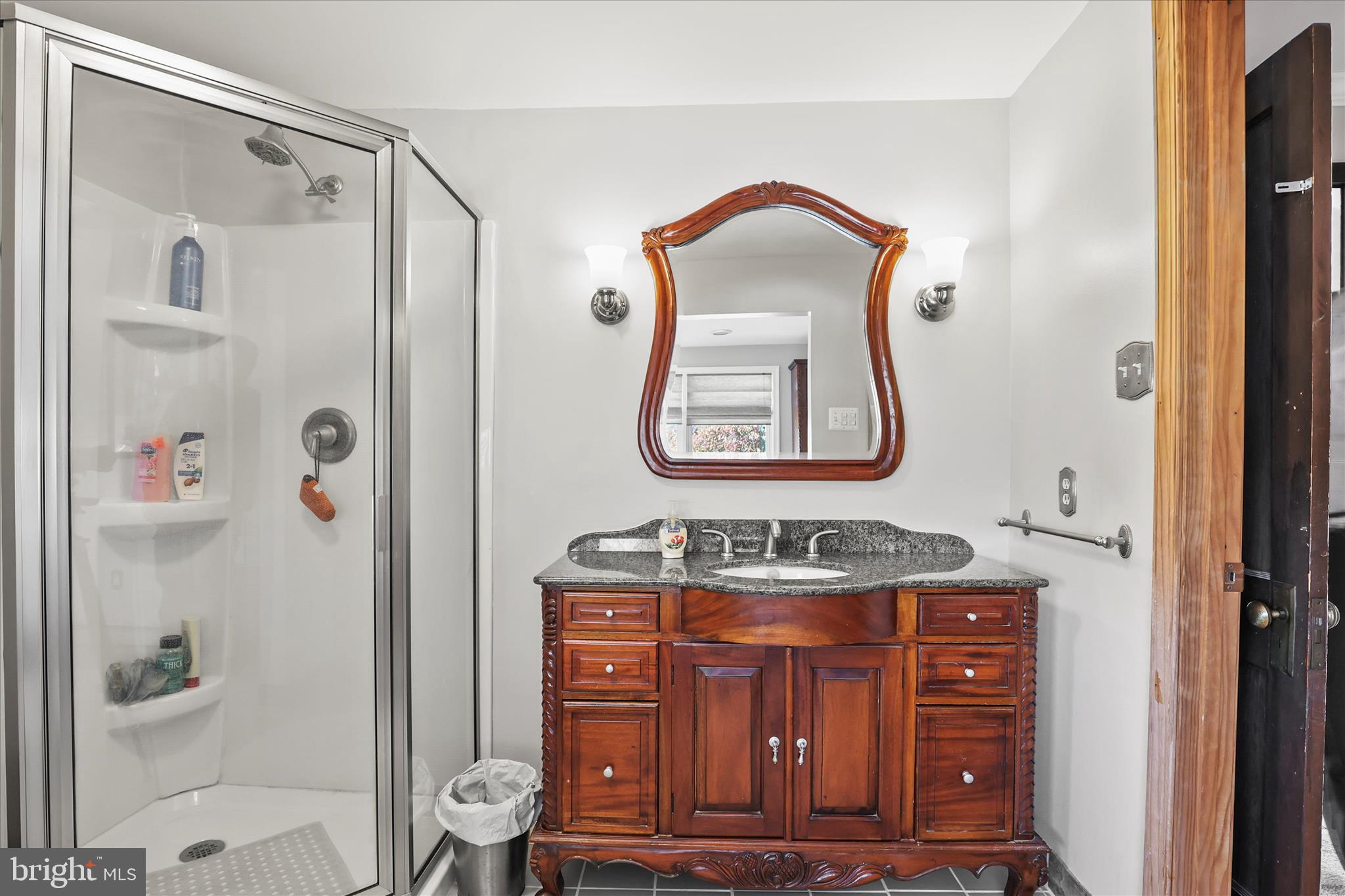 3220 Mt Carmel Road Upperco, MD 21155 - Photo 18 of 44 a bathroom with a sink a mirror and shower