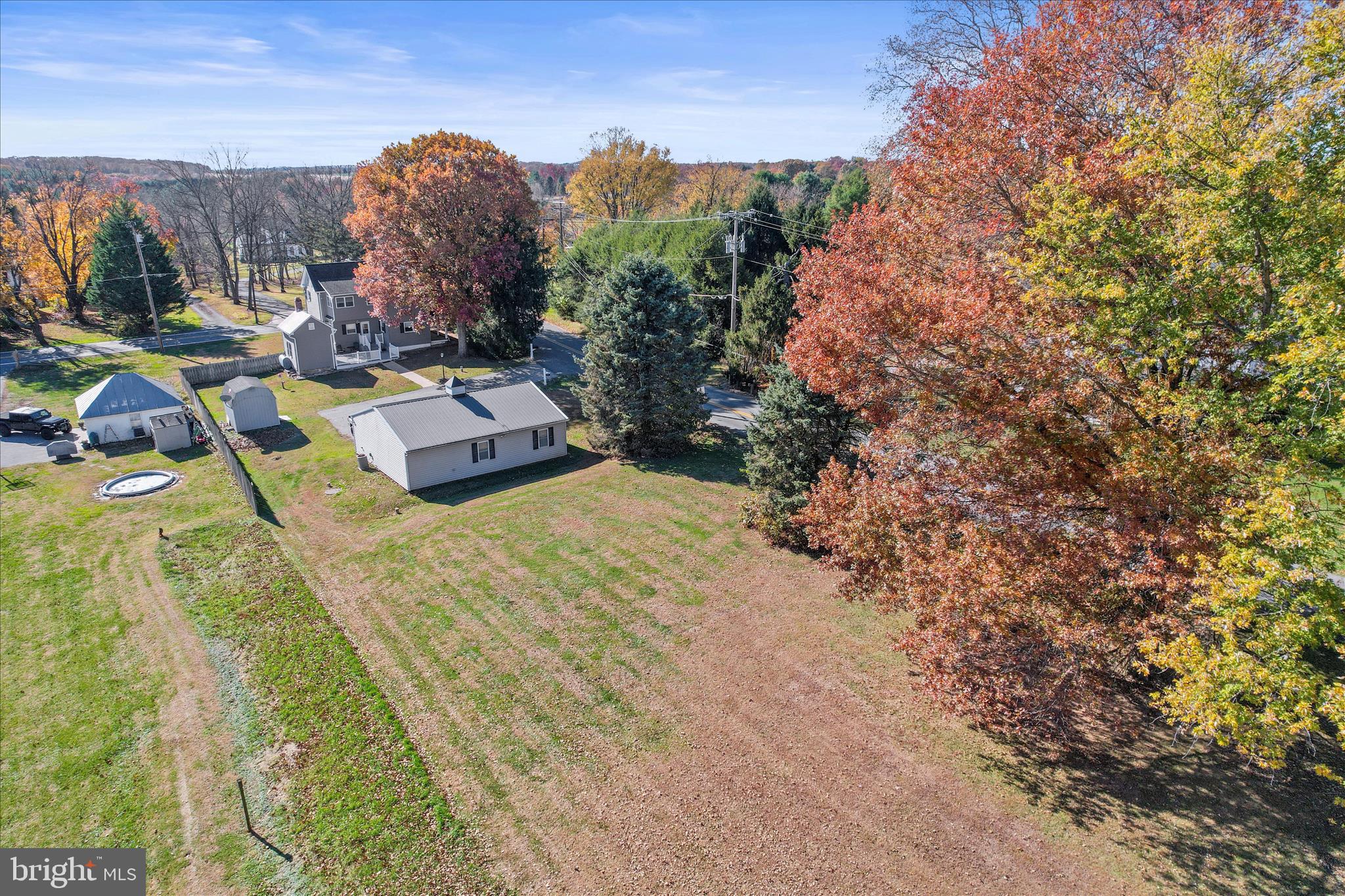 3220 Mt Carmel Road Upperco, MD 21155 - Photo 32 of 44 a view of a swimming pool with an outdoor seating and a yard