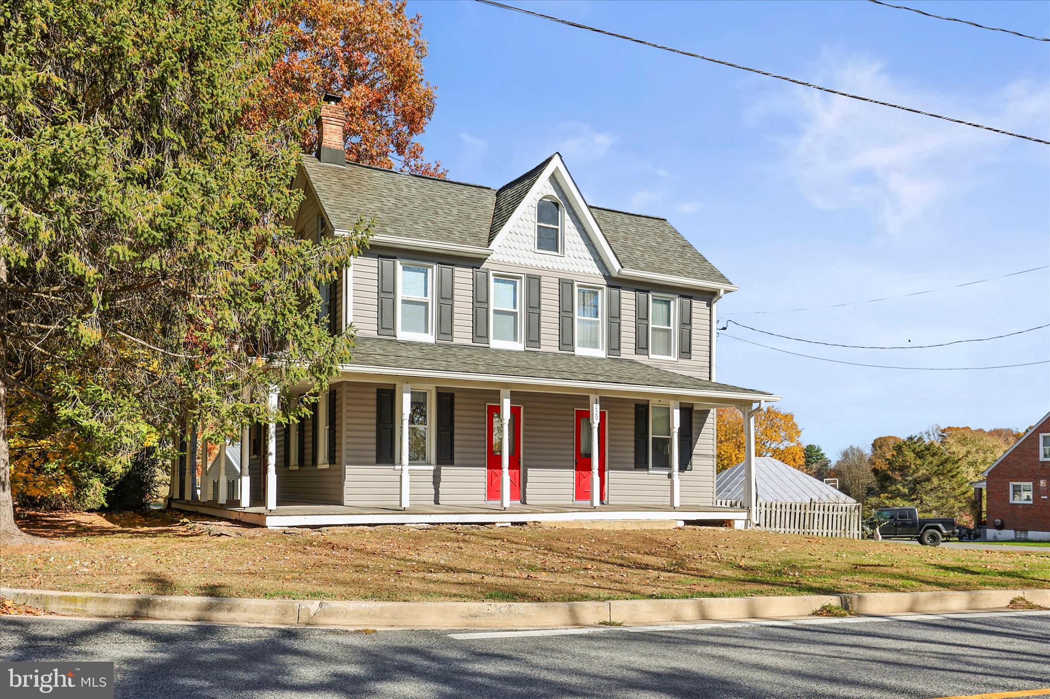 3220 Mt Carmel Road Upperco, MD 21155 - Photo 35 of 44 a front view of a house with a garden