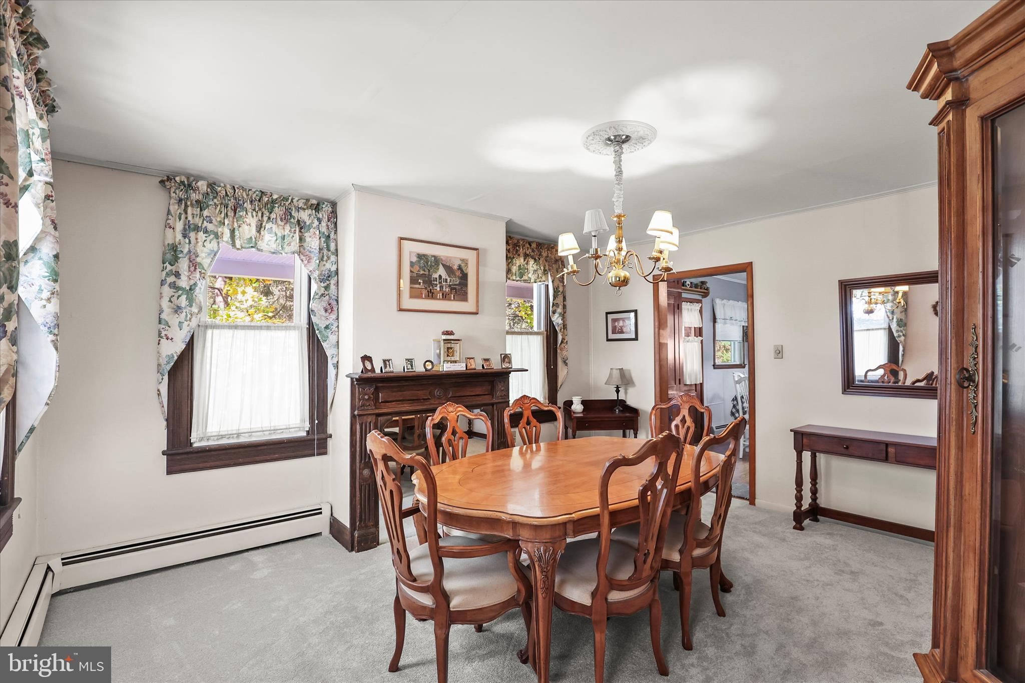 3220 Mt Carmel Road Upperco, MD 21155 - Photo 9 of 44 a view of a dining room with furniture and chandelier