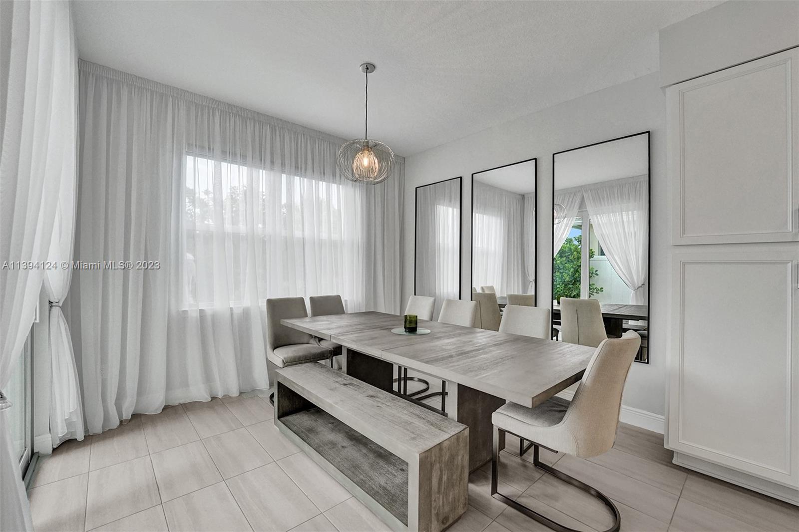 1033 Eucalyptus Drive Hollywood, FL 33021 - Photo 13 of 66 a dining room with furniture and window