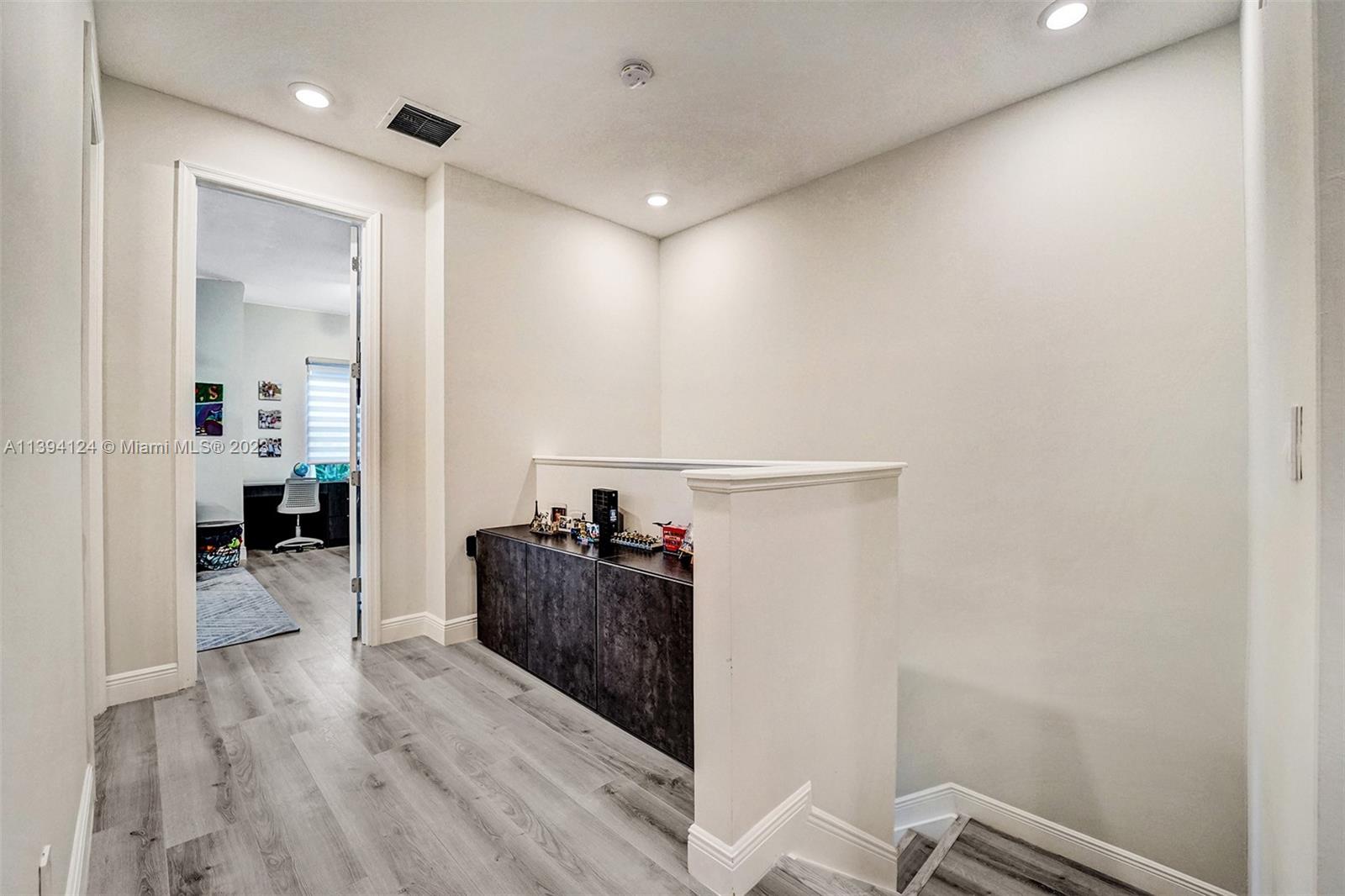 1033 Eucalyptus Drive Hollywood, FL 33021 - Photo 16 of 66 a living room with furniture and a wooden floor