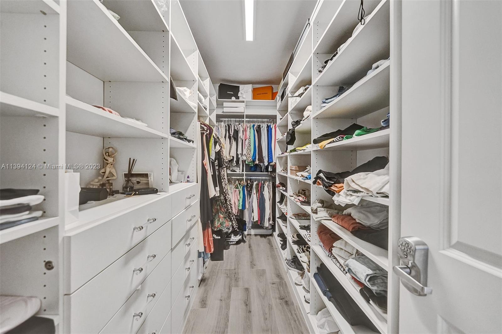 1033 Eucalyptus Drive Hollywood, FL 33021 - Photo 25 of 66 a view of a hallway with wooden floor and front door