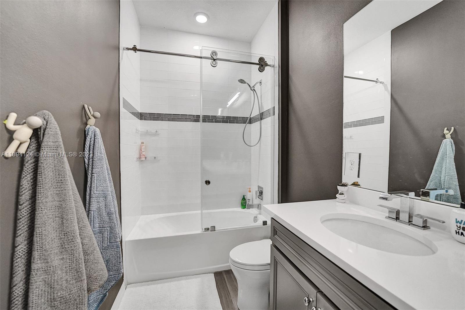 1033 Eucalyptus Drive Hollywood, FL 33021 - Photo 28 of 66 a bathroom with a sink toilet and shower