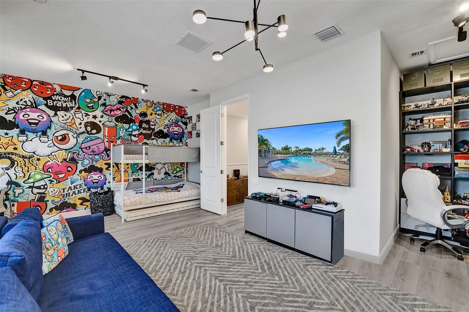 1033 Eucalyptus Drive Hollywood, FL 33021 - Photo 30 of 66 a living room with furniture and a flat screen tv
