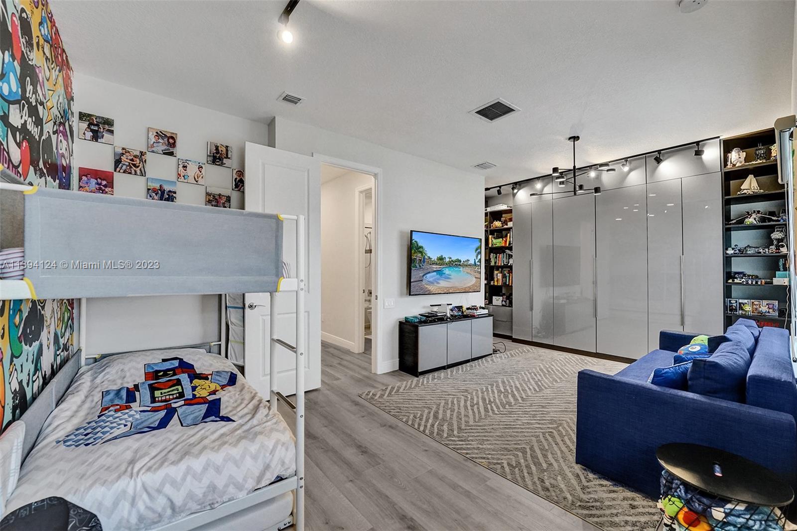 1033 Eucalyptus Drive Hollywood, FL 33021 - Photo 32 of 66 a living room with furniture and a flat screen tv