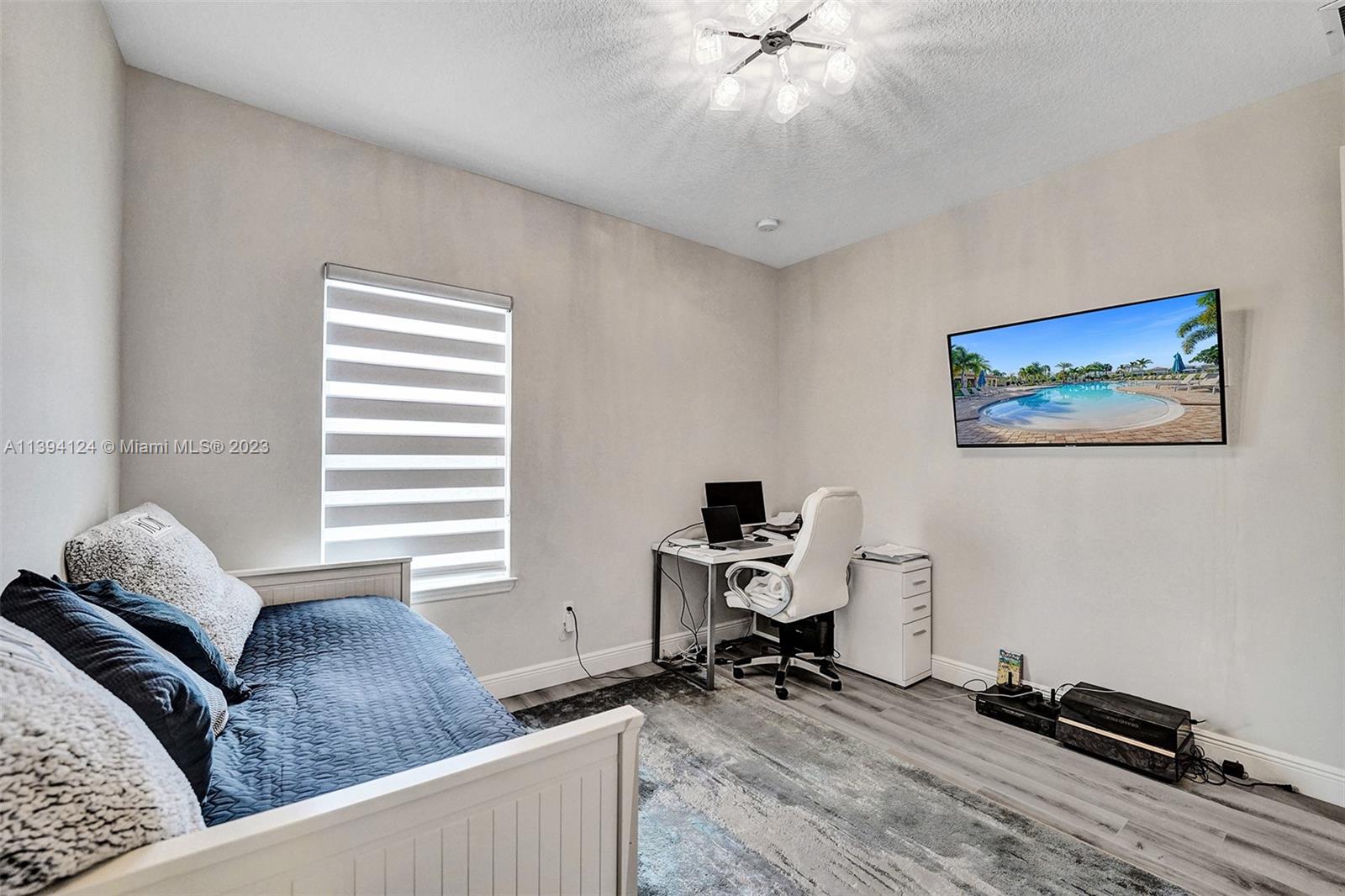 1033 Eucalyptus Drive Hollywood, FL 33021 - Photo 34 of 66 a living room with furniture and a window