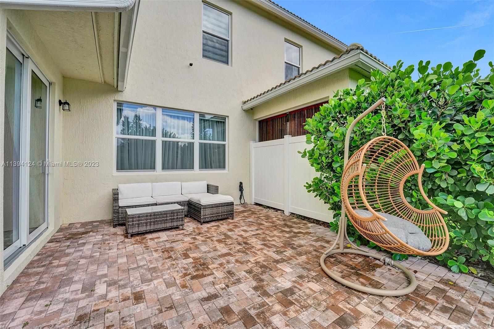 1033 Eucalyptus Drive Hollywood, FL 33021 - Photo 38 of 66 a backyard of a house with table and chairs