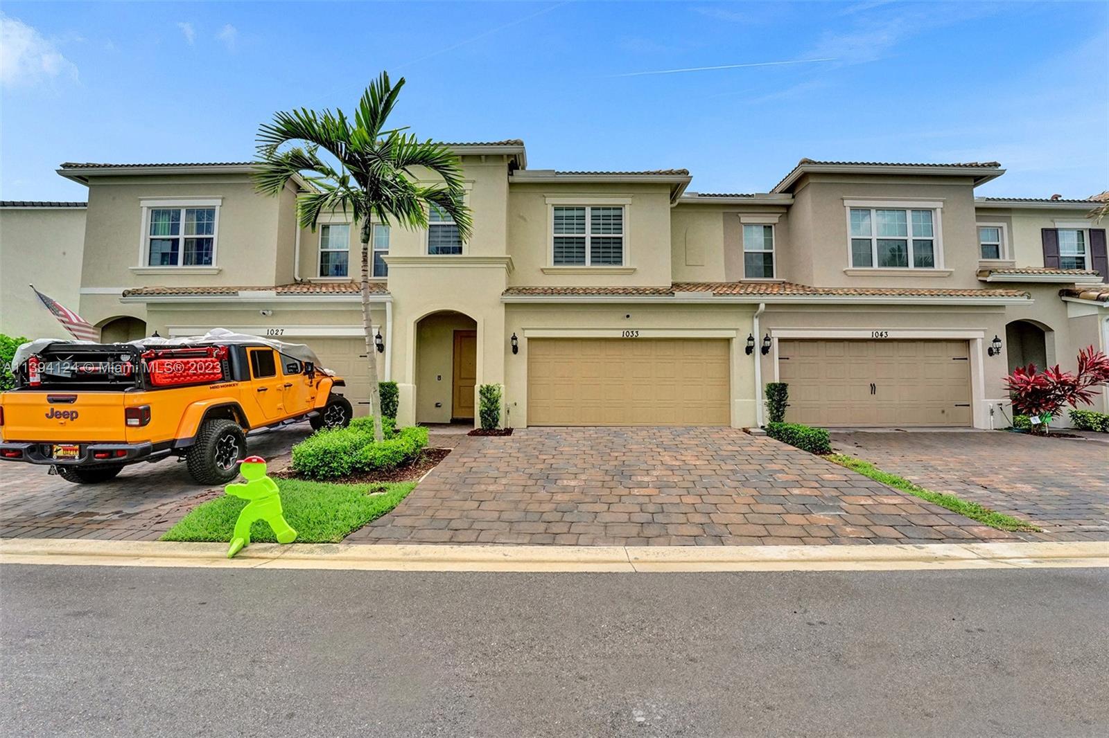 1033 Eucalyptus Drive Hollywood, FL 33021 - Photo 43 of 66 a front view of a house with a yard and garage
