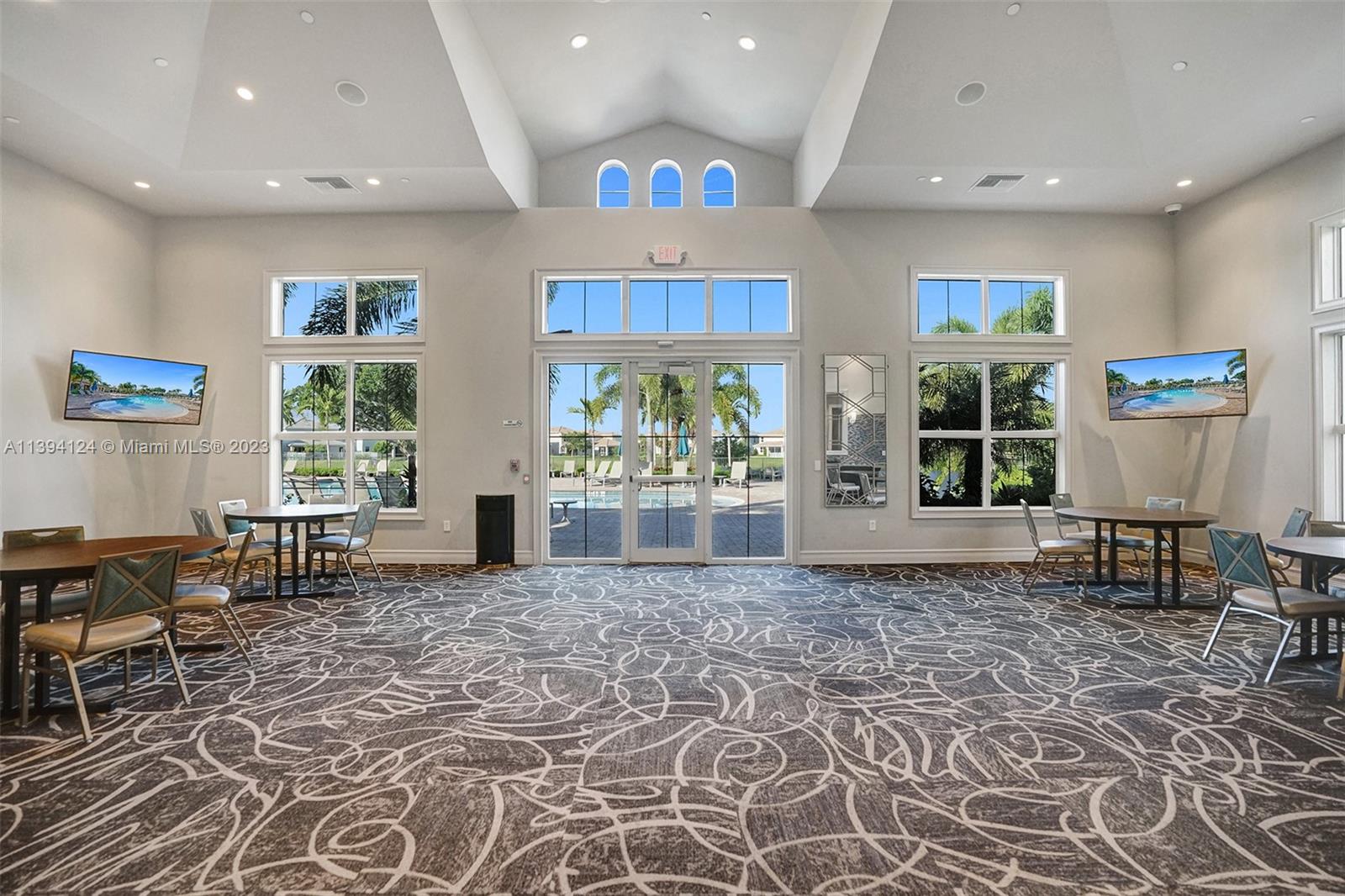1033 Eucalyptus Drive Hollywood, FL 33021 - Photo 49 of 66 a living room with furniture a window and a table