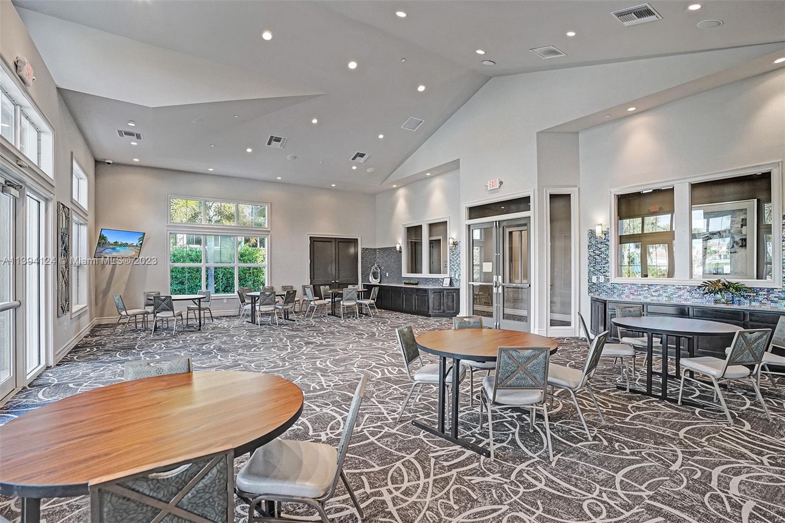 1033 Eucalyptus Drive Hollywood, FL 33021 - Photo 50 of 66 a outdoor dining space with furniture window and wooden floor