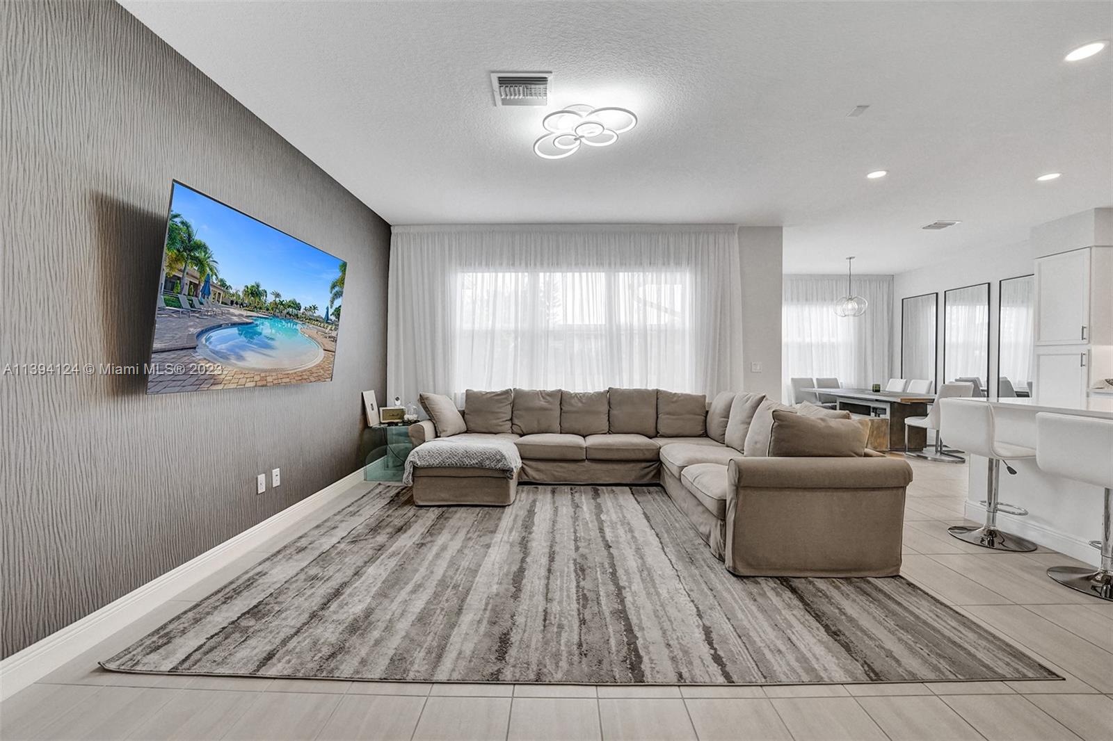 1033 Eucalyptus Drive Hollywood, FL 33021 - Photo 5 of 66 a living room with furniture and a couch