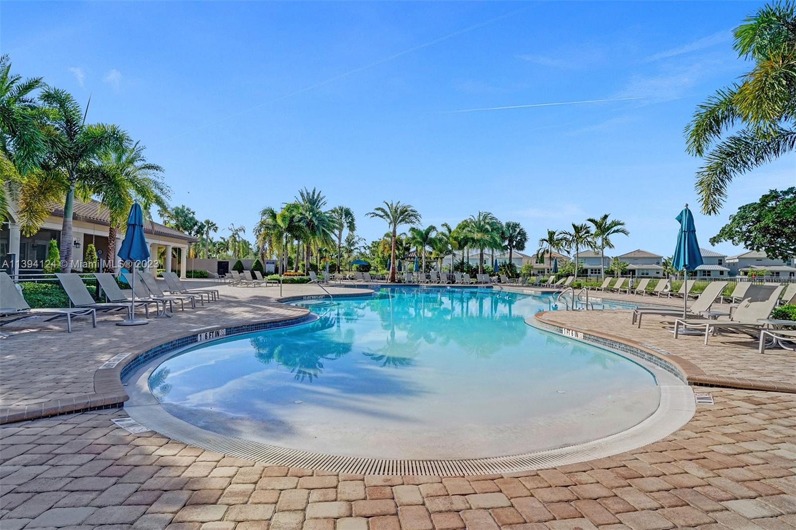 1033 Eucalyptus Drive Hollywood, FL 33021 - Photo 51 of 66 a view of a swimming pool with outdoor seating and plants