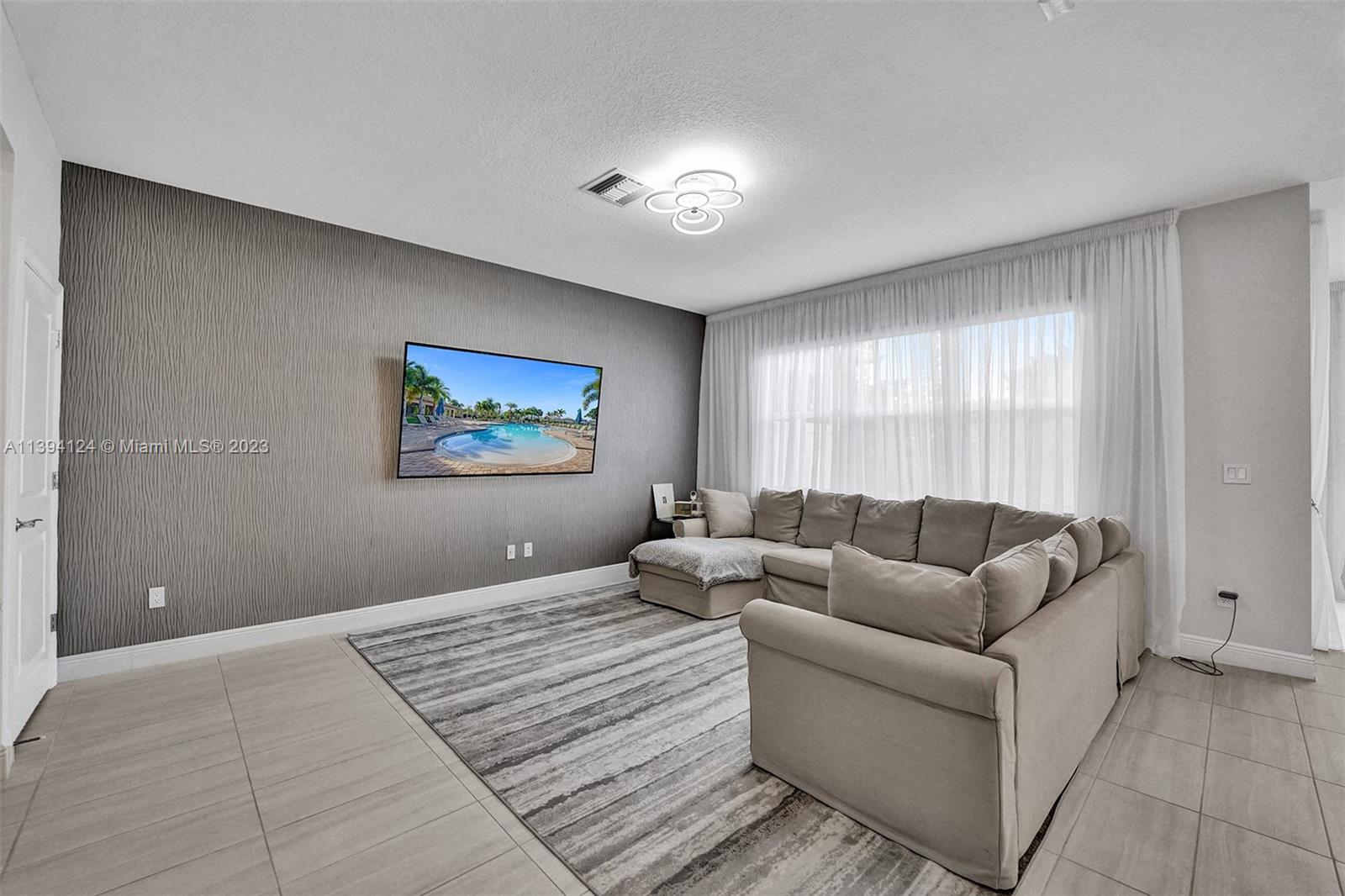 1033 Eucalyptus Drive Hollywood, FL 33021 - Photo 6 of 66 a bedroom with furniture and a large window