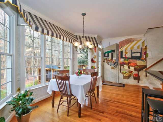 9437 Macon Road Raleigh, NC 27613 - Photo 9 of 25 Bright breakfast area with bay window! Enjoy gorgeous scenery with your meals. Breakfast Area