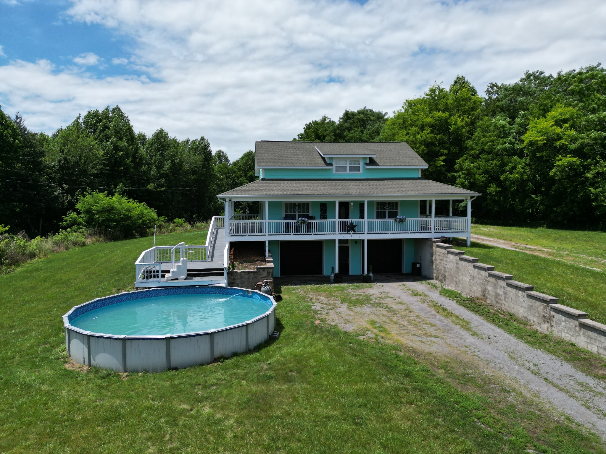 581 Shady Grove Road Bloomington Springs, TN 38545 - Photo 15 of 42 a view of a house with a yard and sitting area