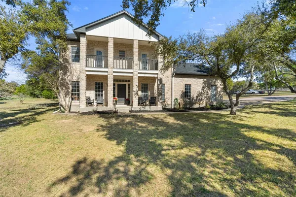 a front view of a house with swimming pool