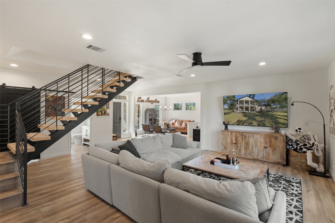 310 Saddle Blanket Drive Dripping Springs, TX 78620 - Photo 14 of 40 a living room with furniture and wooden floor