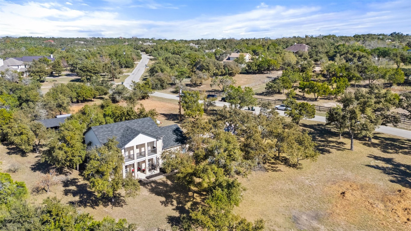 310 Saddle Blanket Drive Dripping Springs, TX 78620 - Photo 2 of 40 an aerial view of residential houses with outdoor space and trees