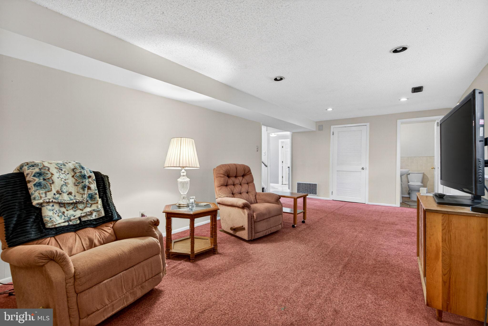 46 Trinity Avenue Marlton, NJ 08053 - Photo 22 of 37 a living room with furniture and a flat screen tv
