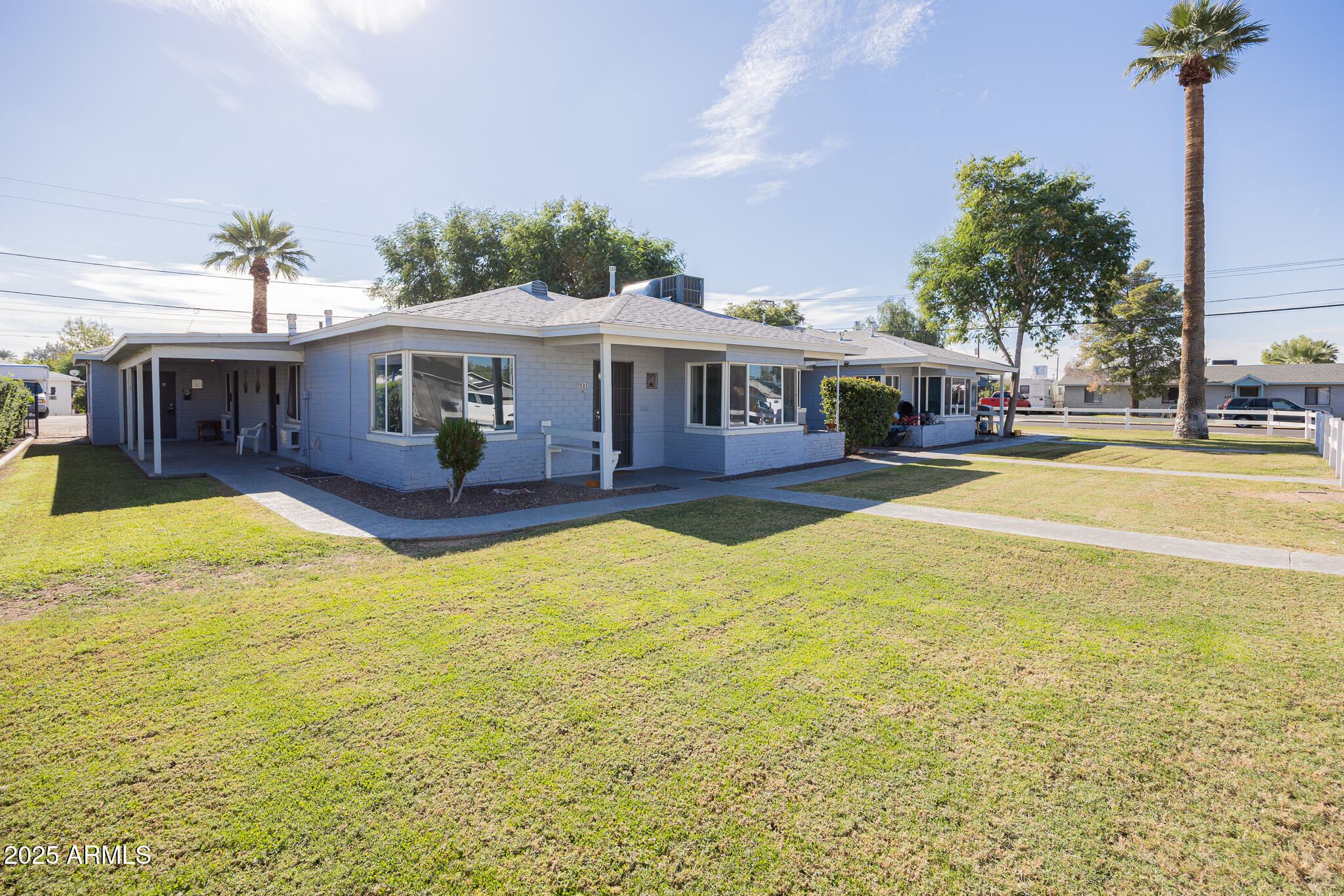 a view of a house with swimming pool and porch
