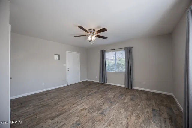 a view of an empty room with a window