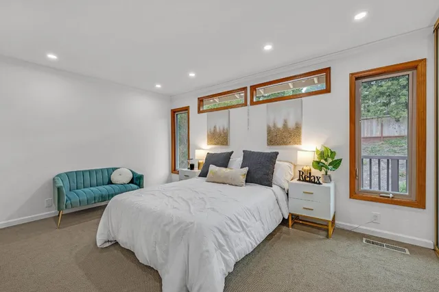 a bedroom with bed and a window