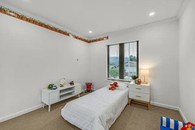 a bed room with furniture and a window