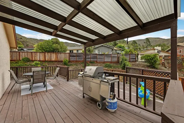 a view of a chairs and table on the deck
