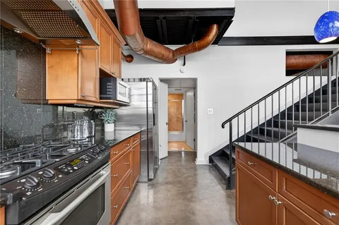 a bedroom with a bed and cabinets