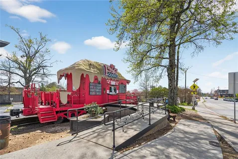 a view of a porch room with furniture and a table