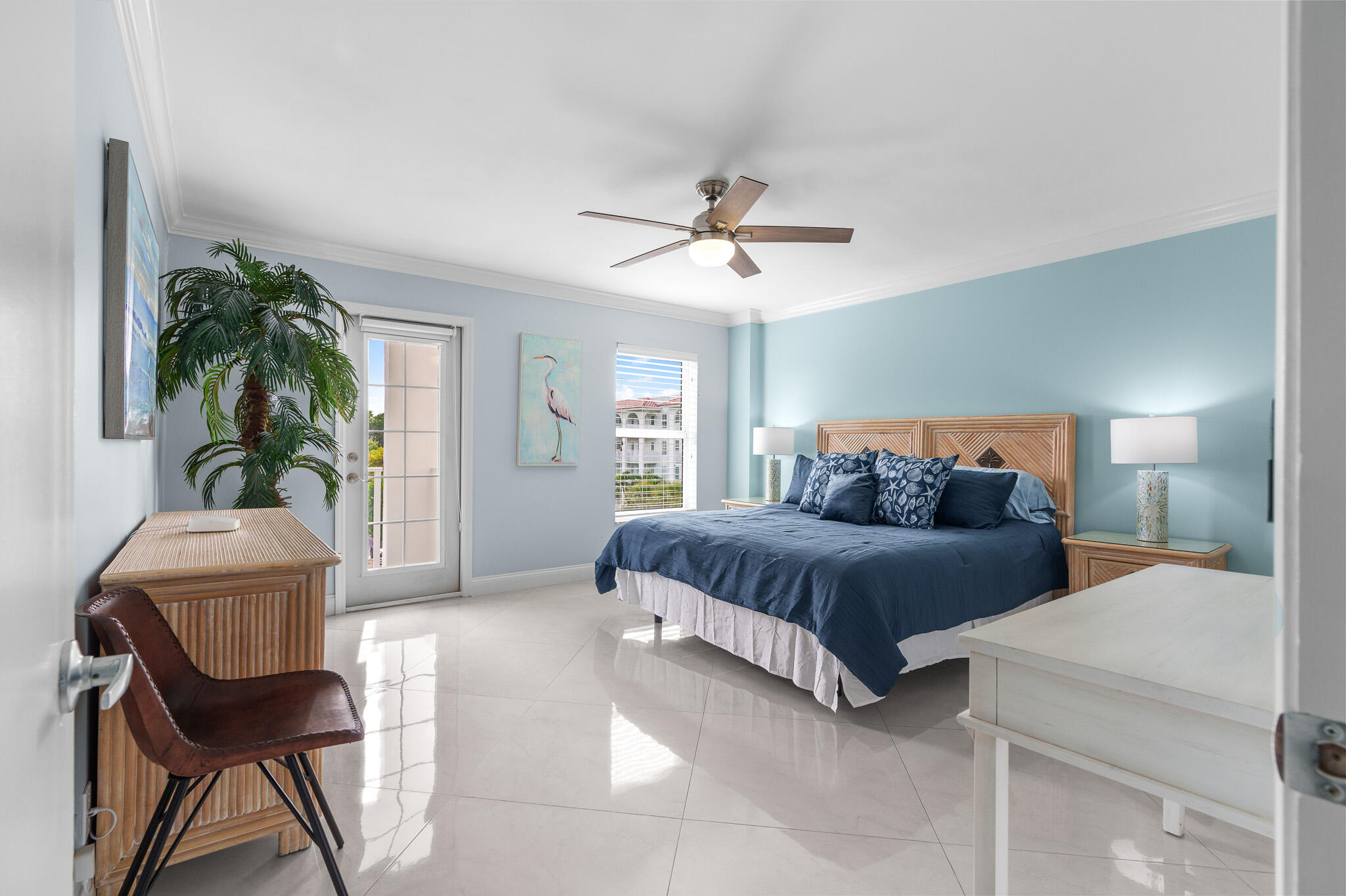 950 Ponce De Leon Road, Unit 401 Boca Raton, FL 33432 - Photo 18 of 35 a spacious bedroom with a bed and a potted plant