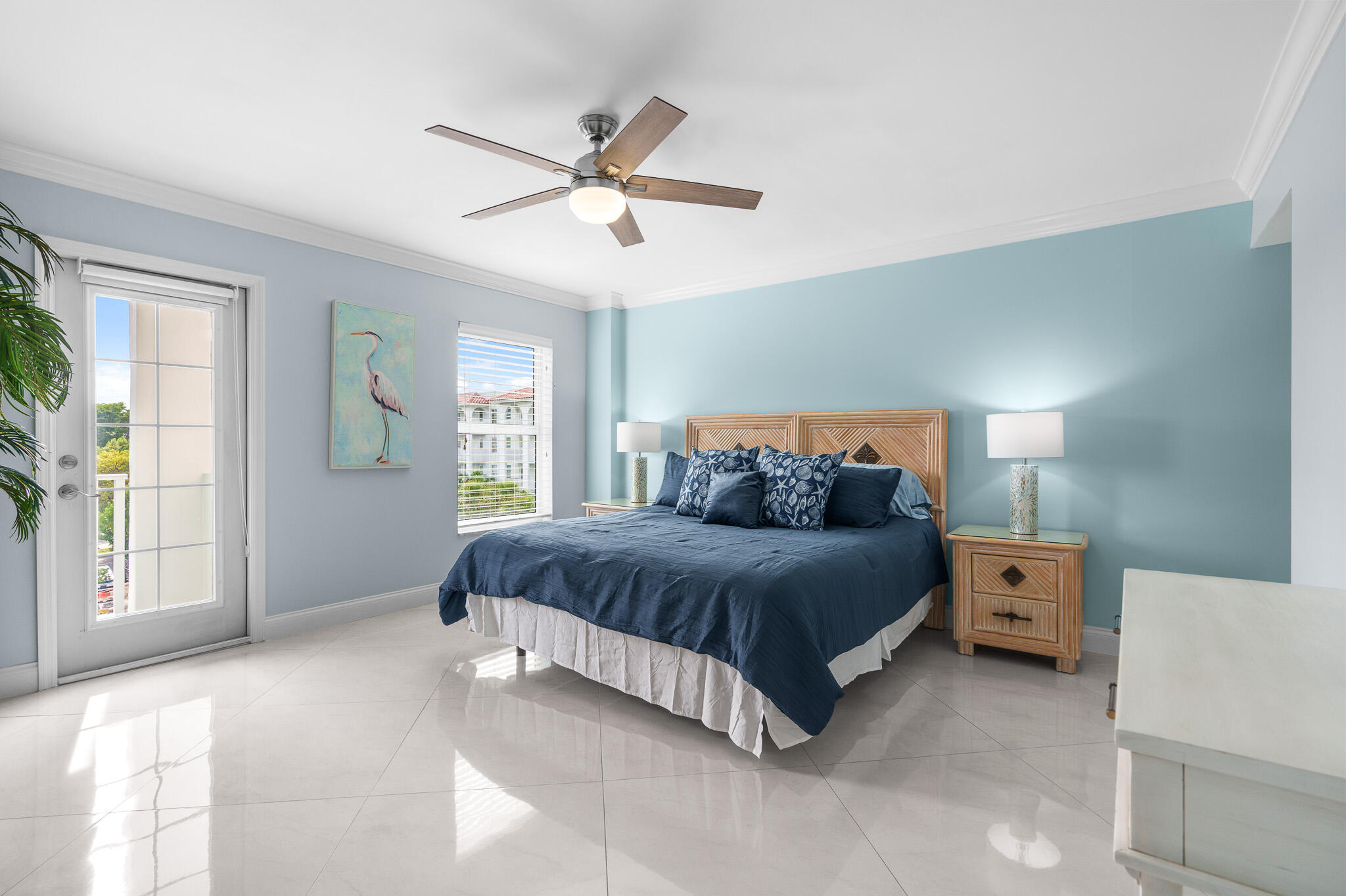 950 Ponce De Leon Road, Unit 401 Boca Raton, FL 33432 - Photo 19 of 35 a spacious bedroom with a bed and window