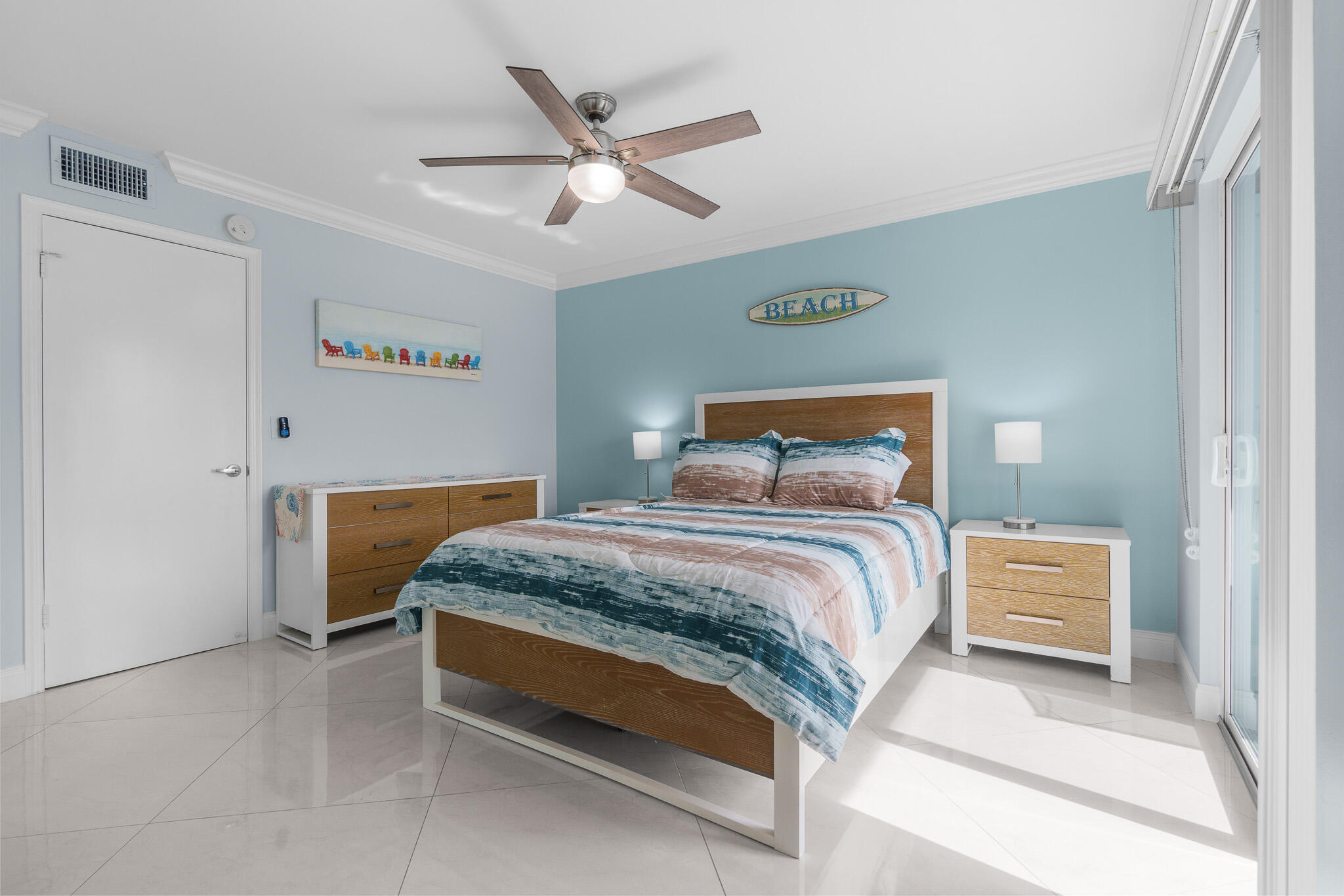 950 Ponce De Leon Road, Unit 401 Boca Raton, FL 33432 - Photo 26 of 35 a bedroom with a bed and a chandelier