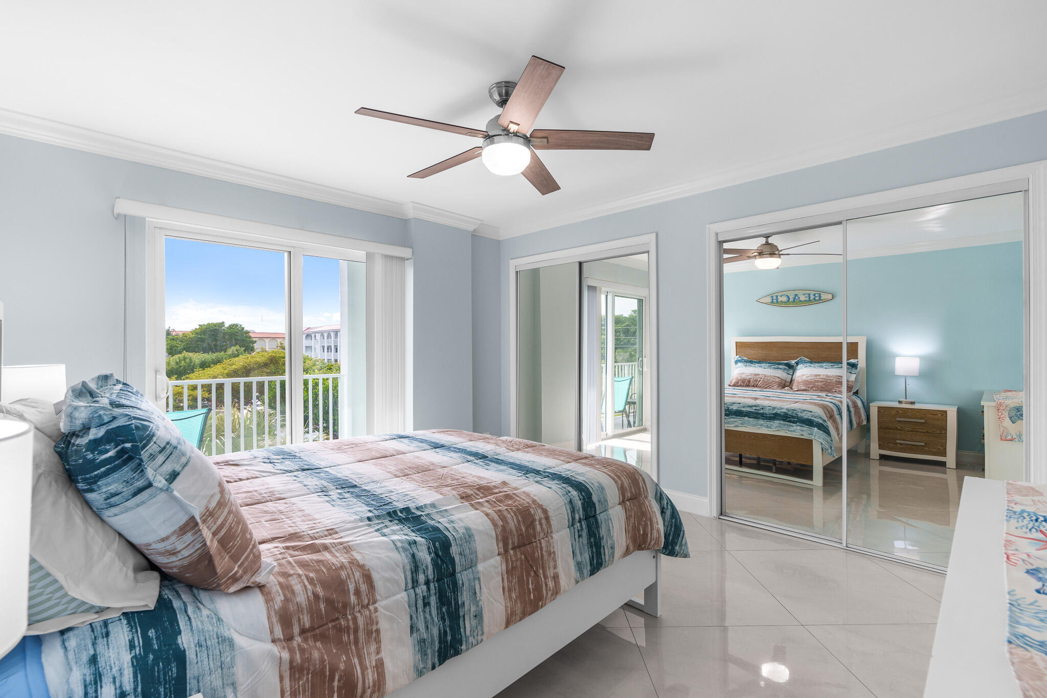 950 Ponce De Leon Road, Unit 401 Boca Raton, FL 33432 - Photo 27 of 35 a bedroom with a bed and a large window