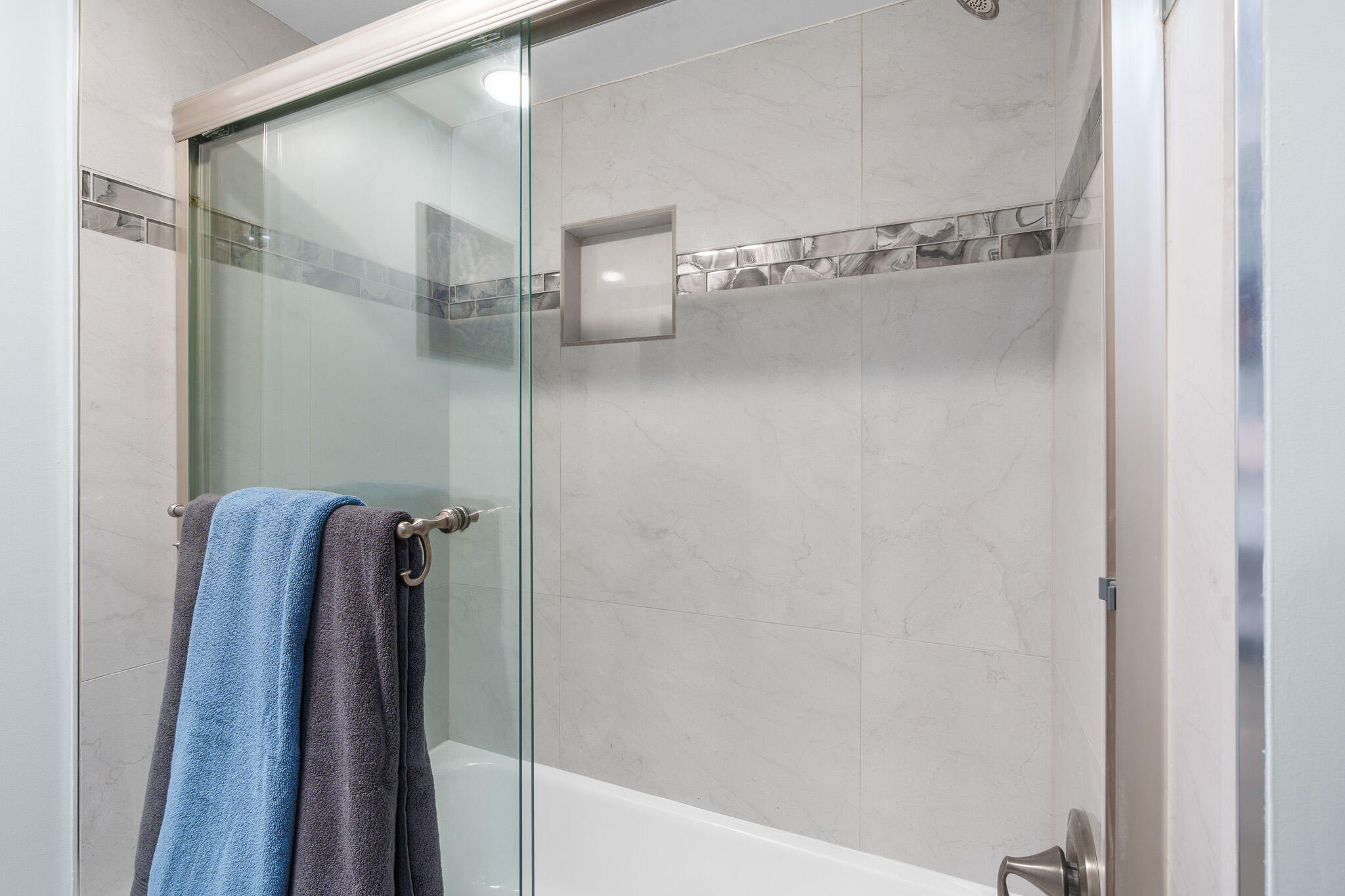 950 Ponce De Leon Road, Unit 401 Boca Raton, FL 33432 - Photo 29 of 35 a bathroom with a shower and a glass door