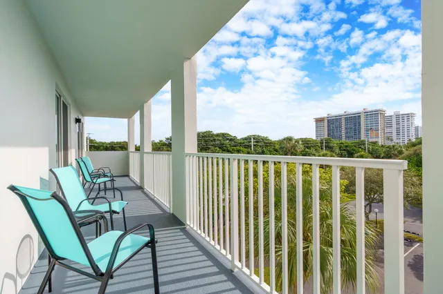 a view of balcony with furniture