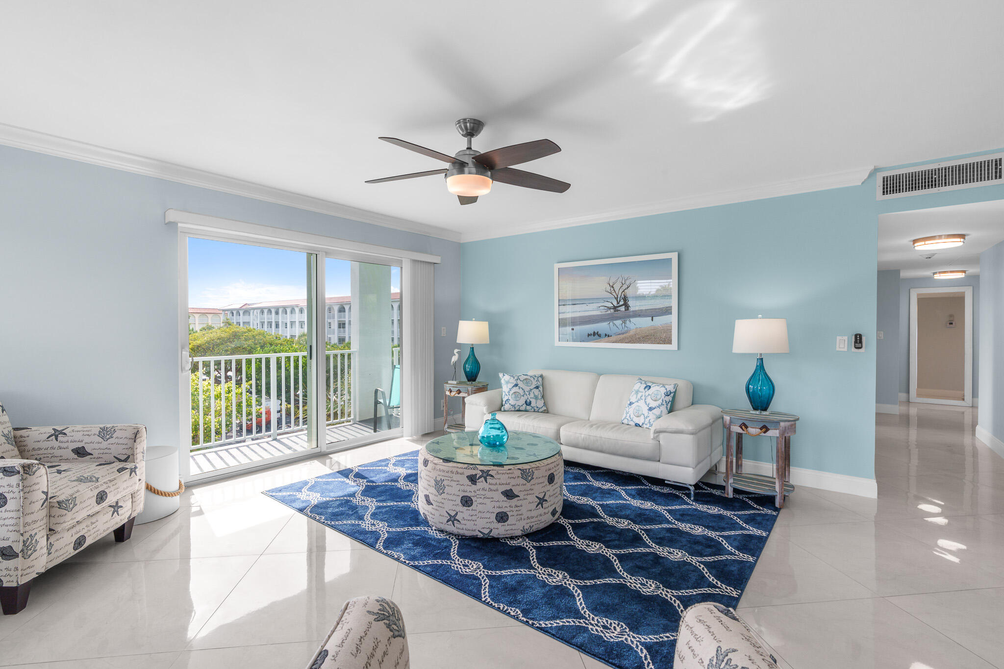 950 Ponce De Leon Road, Unit 401 Boca Raton, FL 33432 - Photo 6 of 35 a living room with furniture and wooden floor
