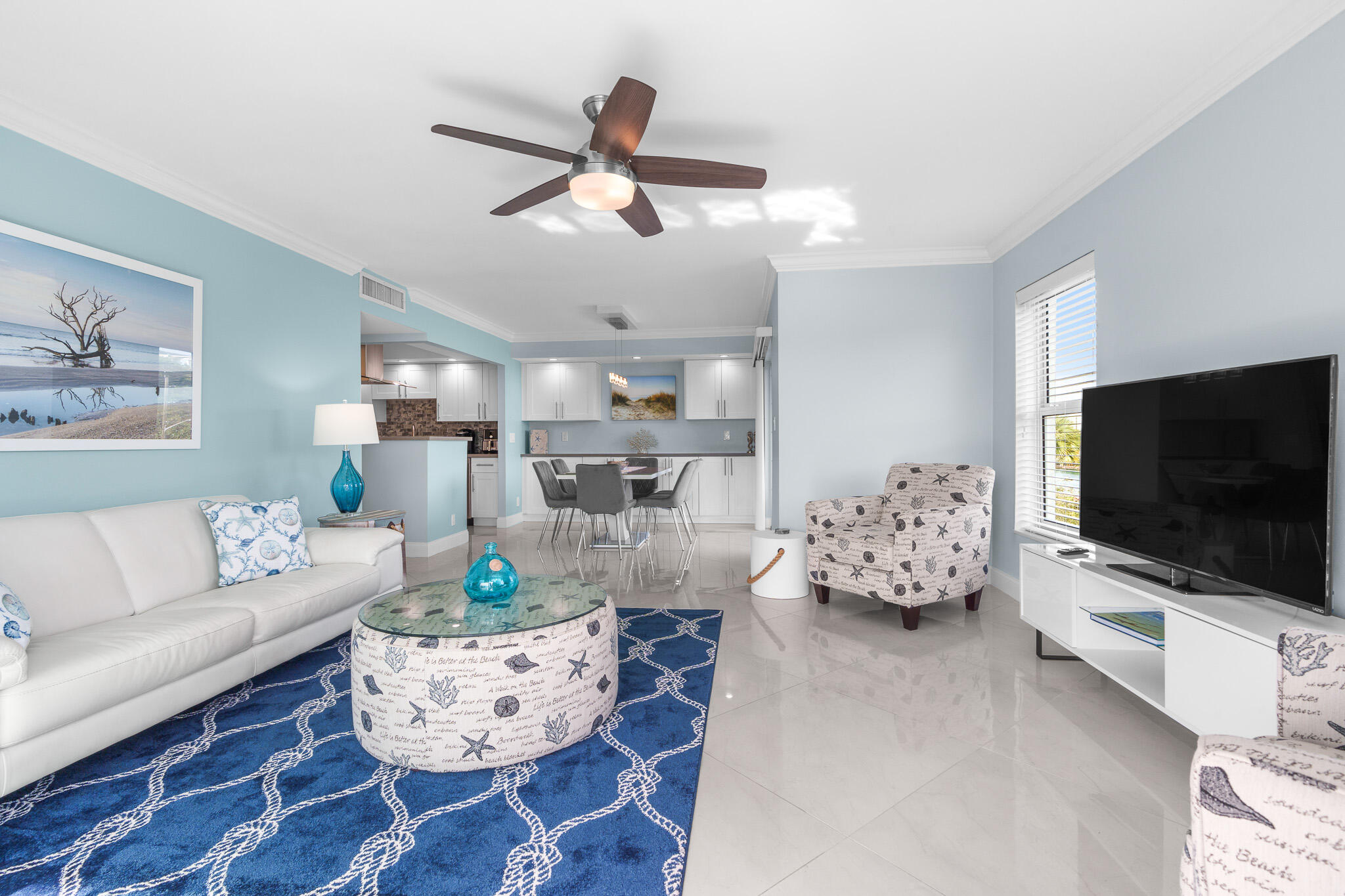 950 Ponce De Leon Road, Unit 401 Boca Raton, FL 33432 - Photo 7 of 35 a living room with furniture and a flat screen tv